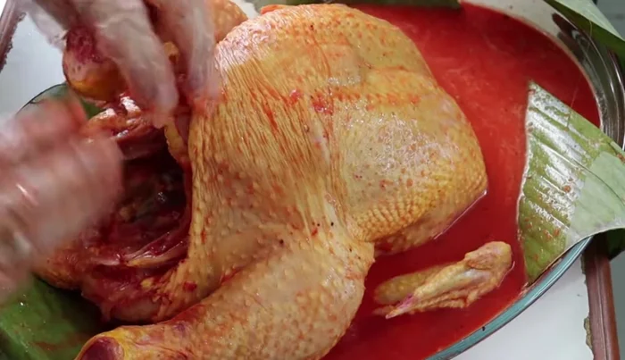 Marinate the chicken for at least 2-3 hours, preferably overnight, in the refrigerator, covered with a banana leaf and optionally an aluminum foil, plastic bag, or baking bag.