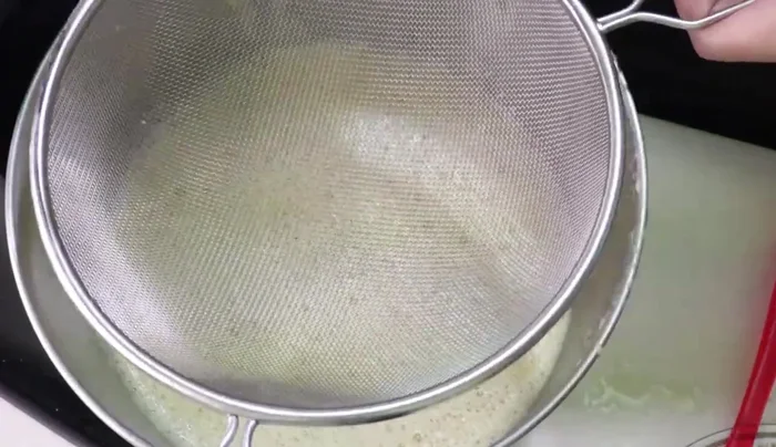 Sift the flour and baking powder into the mixture and mix until combined.