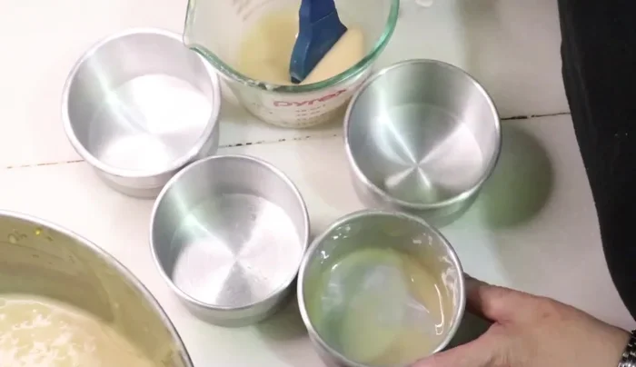 Preheat oven to 200°C (400°F), then reduce to 180°C (350°F) after placing the muffins in the oven. Bake for 45 minutes, or until a toothpick inserted into the center comes out clean.