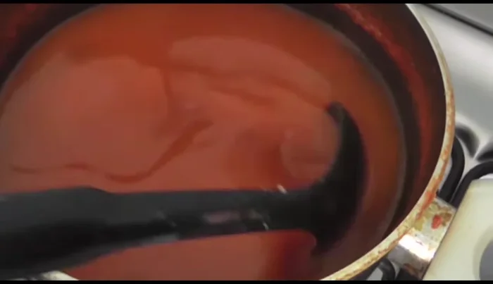 Dip the stuffed peppers in the egg mixture.