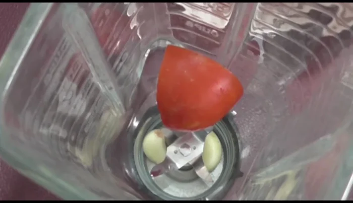 Blend garlic, tomatoes, and onion with water until smooth.