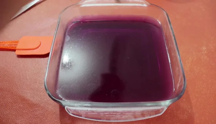 Once set, cut the strawberry gelatin into small squares (203).