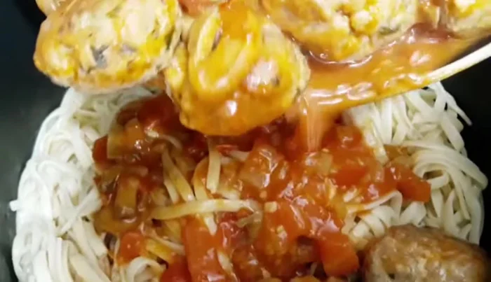 Add the meatball sauce to the pasta and mix well. Simmer for 5 minutes.