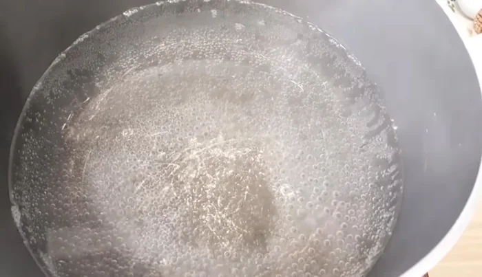 Boil water in a pot for the pasta. Add a splash of oil and salt.