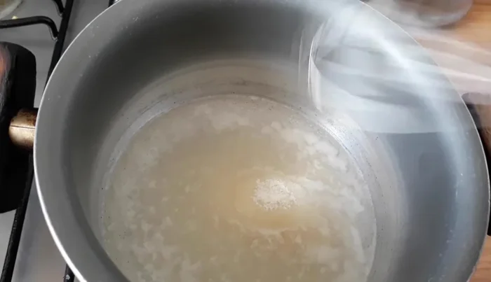 Add transparent gelatin to the boiling water and stir until dissolved. Chill the gelatin in the freezer.