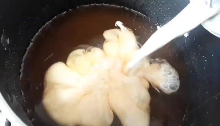 Add the evaporated milk, half-and-half cream, and condensed milk to the syrup mixture. Stir well.