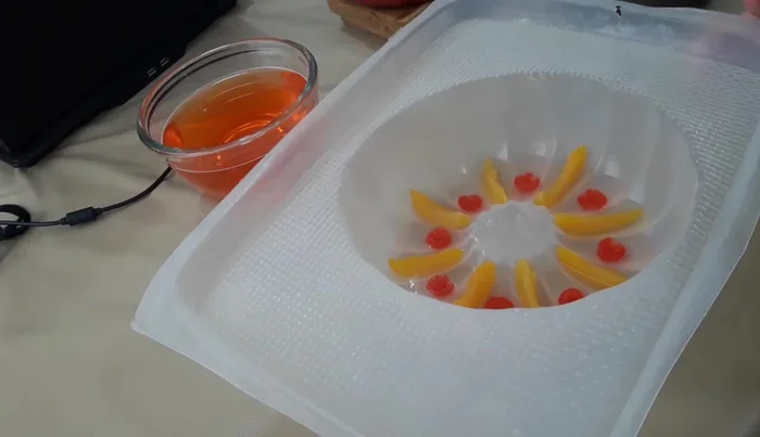 Chill in the freezer until semi-set, then add more fruit layers. Repeat until all layers are set.