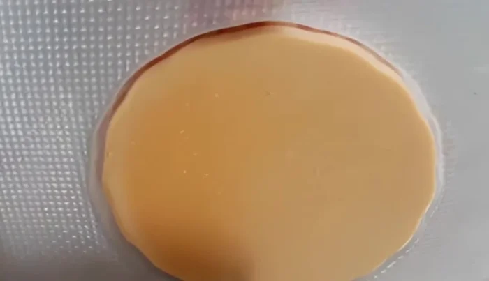 Run a knife or spatula around the edges of the mold. Invert the mold onto a plate to unmold the gelatin.