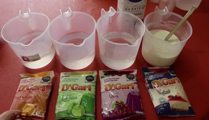 Prepare each gelatin individually. Dissolve one package of gelatin in 3 cups of boiling water. Stir until lumps are dissolved.