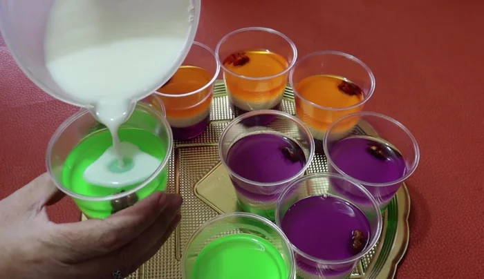 If the milk gelatin starts to set too quickly, microwave it for about 20 seconds to liquefy. Add more milk gelatin as needed to achieve the desired layers.