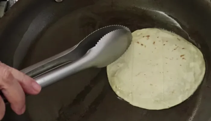 Place the fried tortillas on absorbent paper.