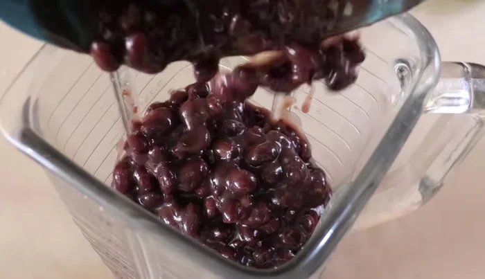 Blend the cooked black beans with 1 cup of water until smooth.