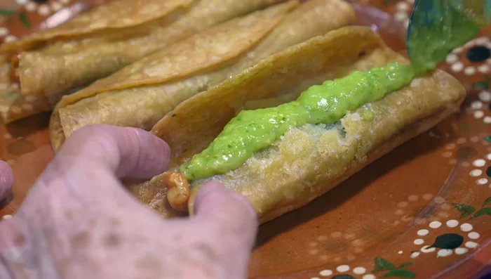 Serve tacos with avocado salsa, lettuce, cream, and crumbled cheese.