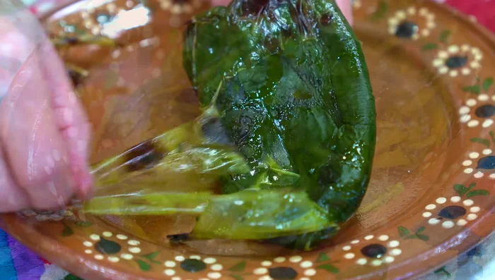 Seed and cut peppers into thin, long strips.