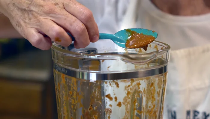 Reserve a small portion of the chili paste; mix the rest with the cooked beans.