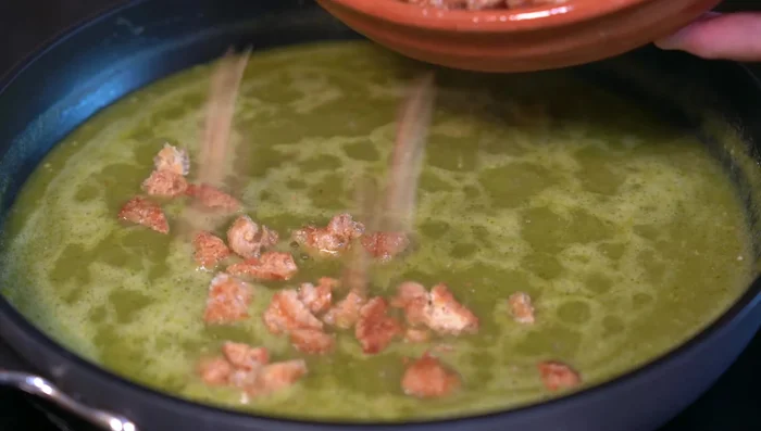 Add pork rinds to the sauce, let it absorb flavors, and then cool.