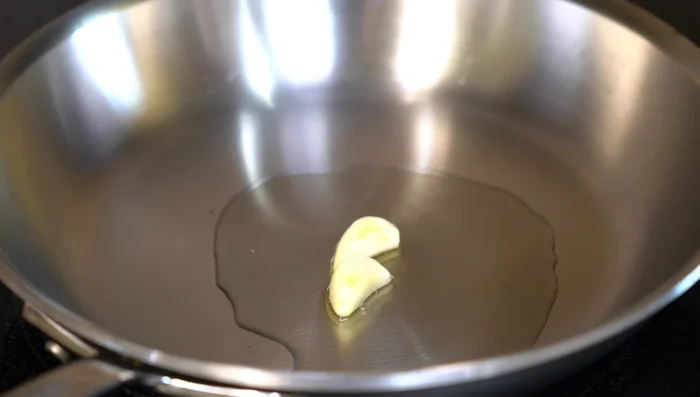 Sauté garlic (2 minutes), then add onion (5-6 minutes). Remove from heat.