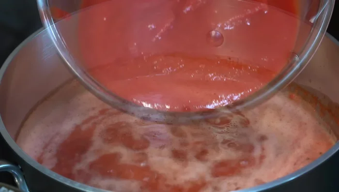 Add tomato puree, stir, add salt, and reduce heat to medium-low. Let the flavors integrate for about 30 minutes. Add Parmesan cheese (optional).