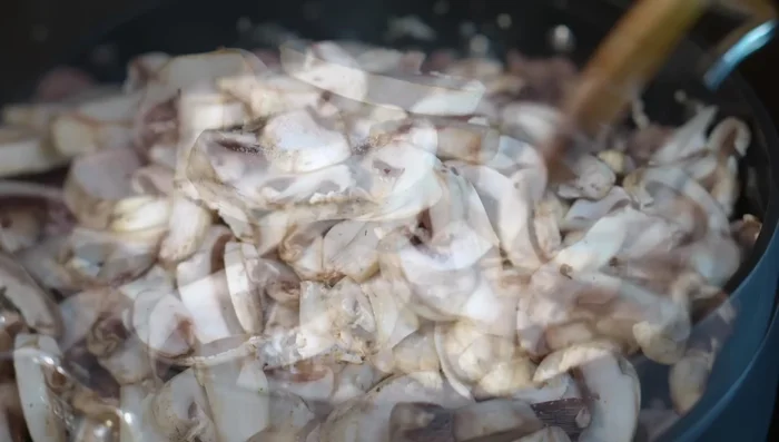 Add sliced mushrooms and salt. Fry with the meat.