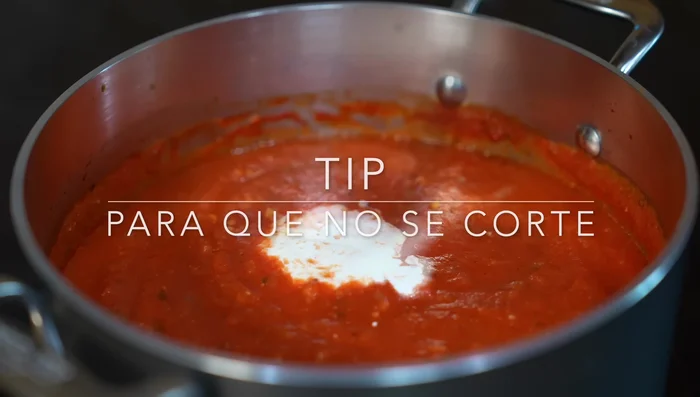 Add warmed tomato sauce, cream, and stir. Cook for 6-10 minutes over medium-high heat.
