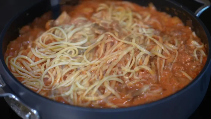 Add pasta, stir well, and add reserved pasta water if needed to prevent drying out. Rectify seasoning with salt or chicken bouillon powder.