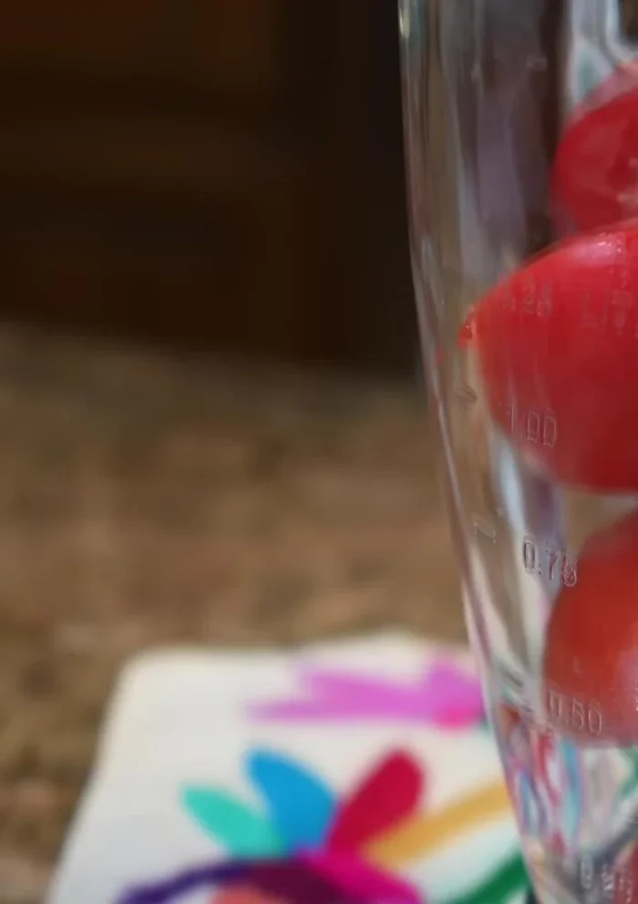 Blend raw tomatoes, onion, and garlic with water until smooth.