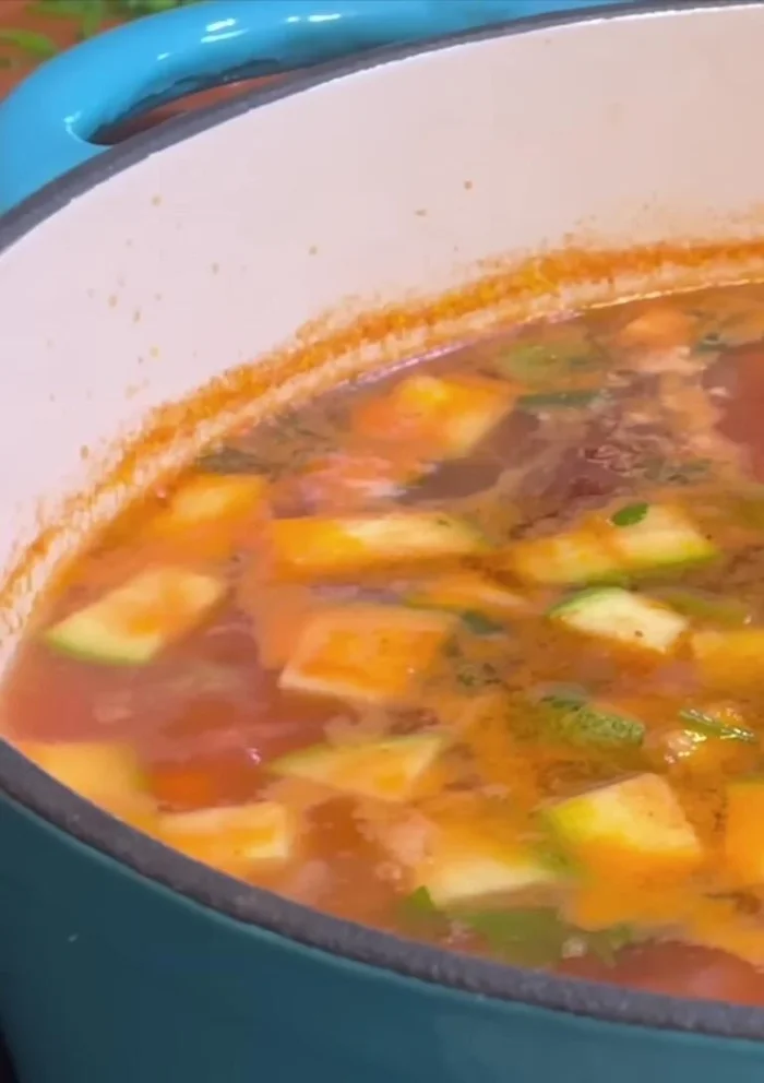 Simmer until zucchini is cooked but still firm. Serve hot.
