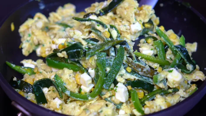 Serve the eggs with warm corn tortillas and refried beans.