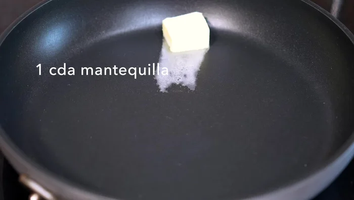 Melt butter in a hot pan. Add a splash of oil to prevent burning.