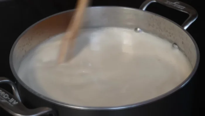 Heat over medium-low heat, stirring constantly to prevent sticking and lumps.