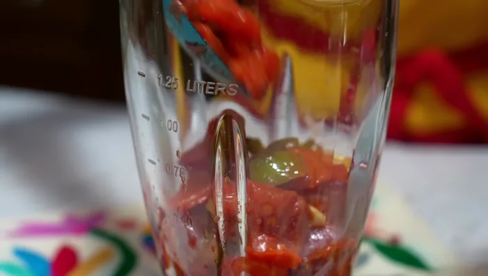Once cool, blend the recaudo with water until smooth.