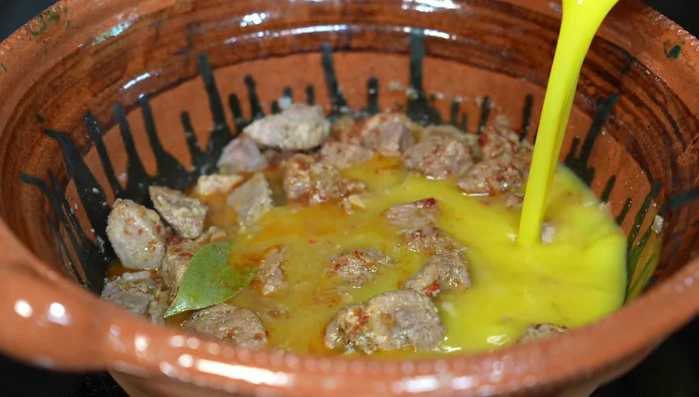 Pour in orange juice, water, and orange zest. Continue cooking until meat is very soft.