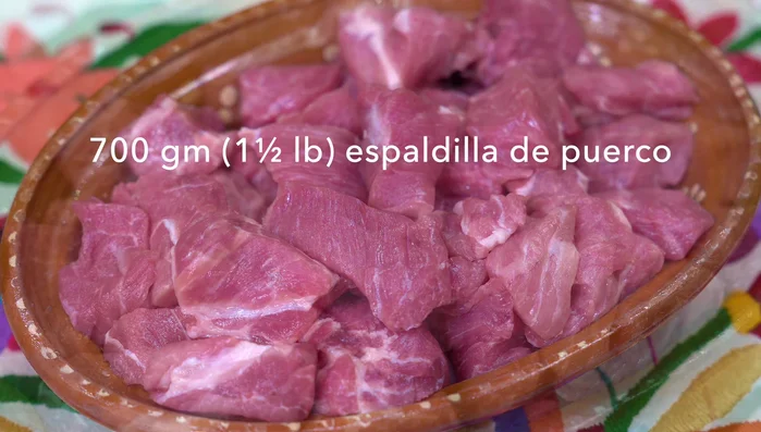 Cut pork shoulder into pieces. Season generously with salt and let it rest for at least half an hour.