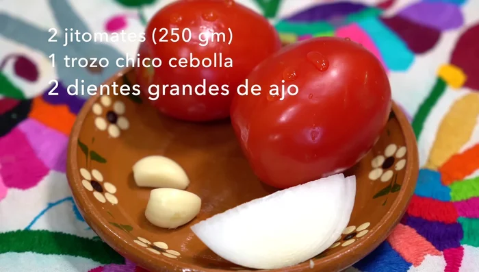 For the sauce: Simmer tomatoes, guajillo, and puya chiles in water until tomato skins burst. Let cool slightly.