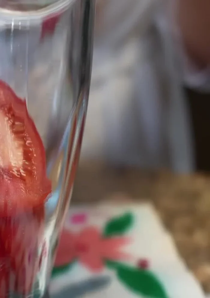Blend the tomatoes, onion, and garlic with water in a blender until smooth.