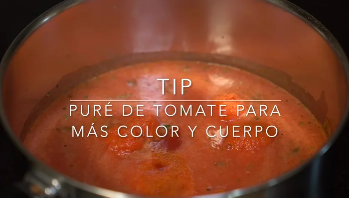 Add the tomato puree and cook for another 10 minutes, allowing flavors to meld.