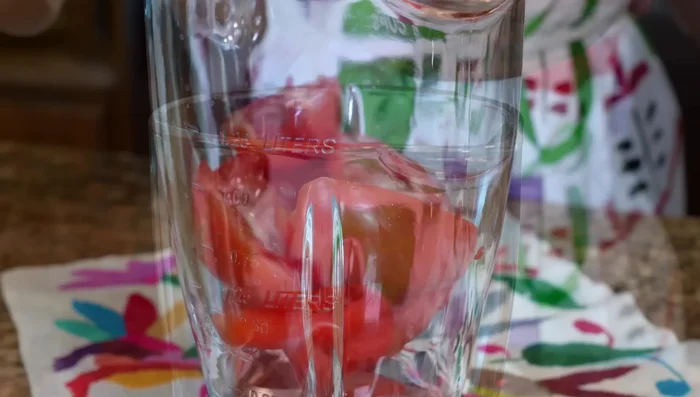 Blend raw tomatoes with a little water until smooth.