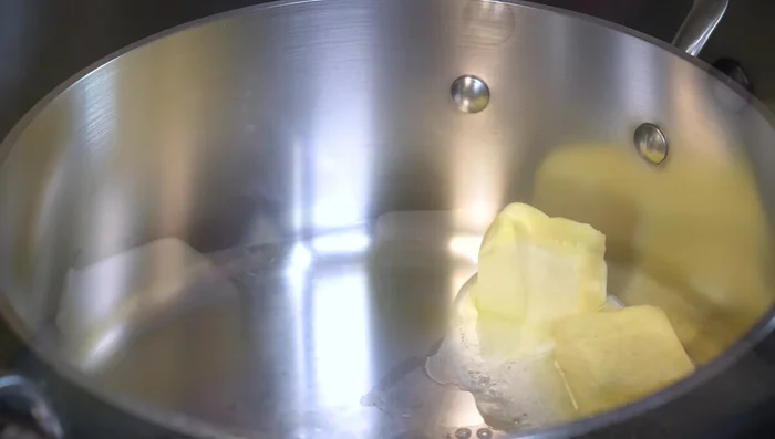 Melt butter and olive oil in a pan. Add chopped onion and cook for 5 minutes.