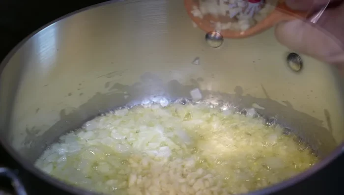 Add chopped garlic, oregano, and basil; cook for 1 minute.