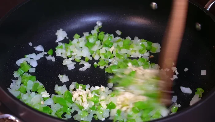 Add ground beef mixture and cook until it falls apart.