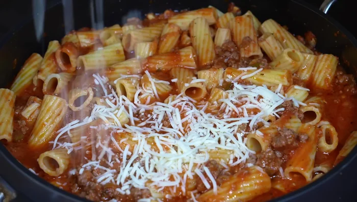 Add mozzarella cheese, cover, and let melt.