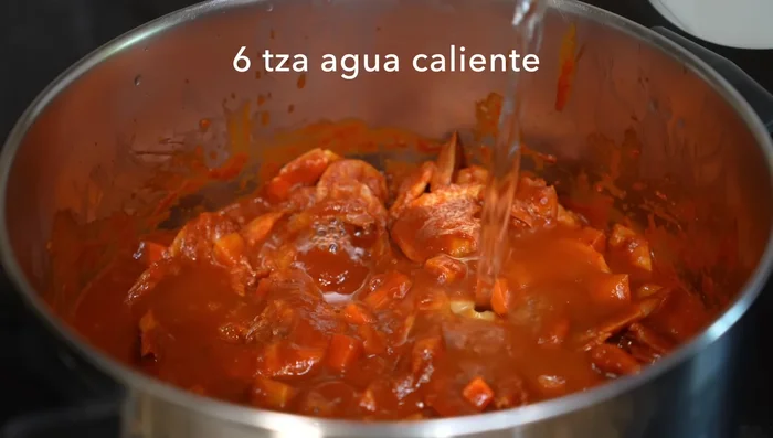 After 15 minutes, add hot water to maintain temperature. Add epazote, season with salt, and simmer for 25 minutes, or until the potato and carrot are cooked.