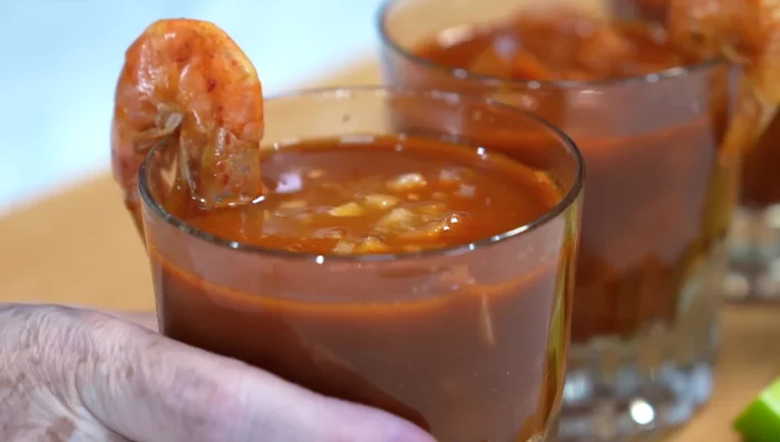 Serve hot, garnished with chopped onion and a squeeze of lemon.
