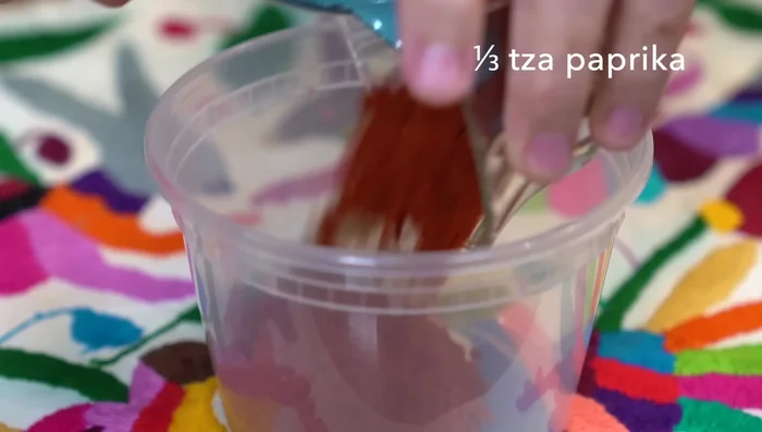 Mix paprika, black pepper, sea salt, brown sugar, garlic powder, onion powder, and chili powder in a container.