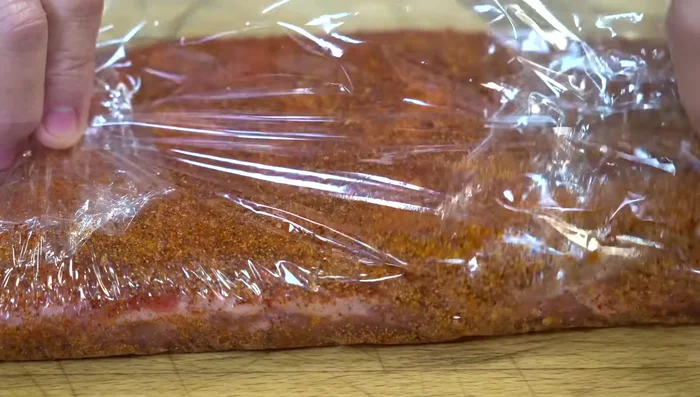 Wrap the seasoned ribs and refrigerate for at least 2 hours (or overnight).