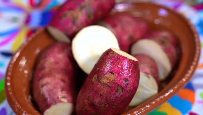 Cut sweet potatoes in half.