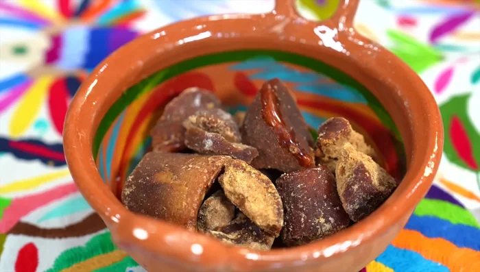 Cut piloncillo into smaller pieces.
