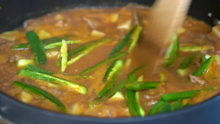 Add jalapeño slices and zucchini. Cover and cook until zucchini is tender and flavors integrate.