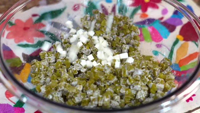 Add the cheese to the cactus mixture.