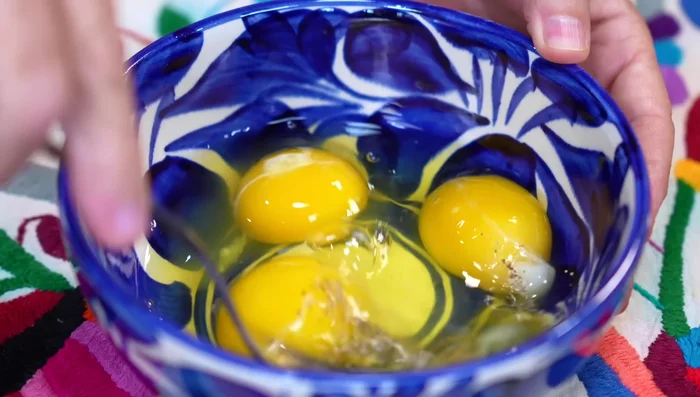 Beat the eggs with salt and pepper.